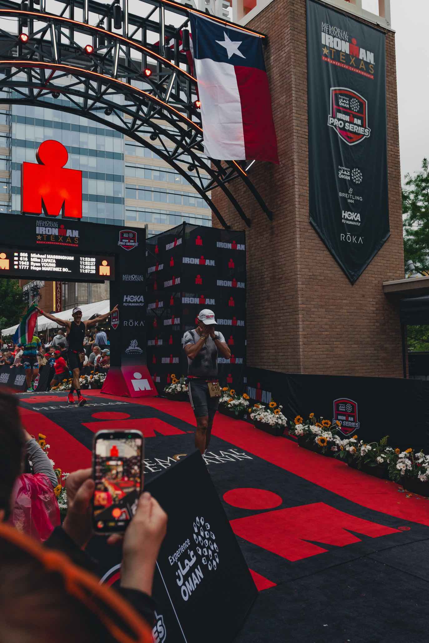 Athlete finishing at the Ironman Texas finish line